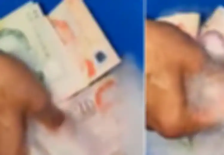 Viral Video Seorang Pria Susah Payah Cuci Uang Dolar Demi Terhindar dari Virus Corona, Benarkah Virus Mematikan Ini Bisa Menular Lewat Benda Mati?