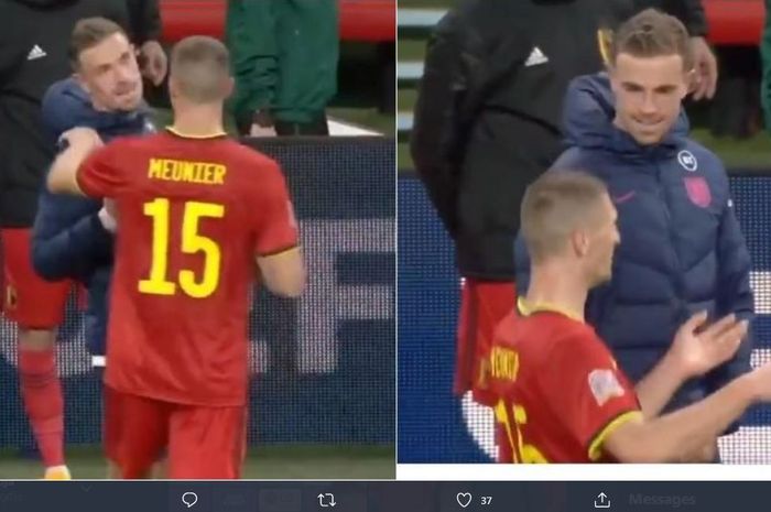 Jordan Henderson dan Thomas Meunier berdiskusi tentang pelanggaran yang melibatkan mereka di pertandingan UEFA Nations League yang mempertemukan Inggris dengan Belgia.