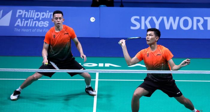 Pasangan ganda putra Indonesia, Fajar Alfian/Muhammad Rian Ardianto, pada partai kedua beregu SEA Games 2019 melawan Malaysia di Muntinlupa Sports Center, Rabu (4/12/2019).