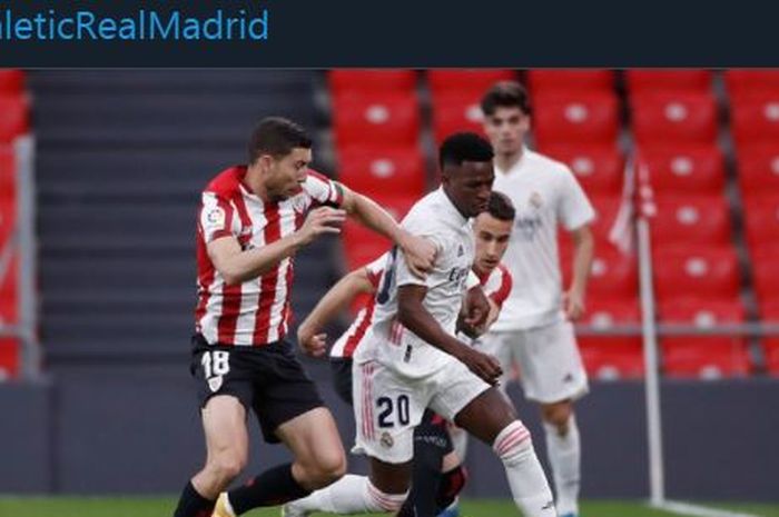 Penyerang Real Madrid, Vinicius Jr. dijepit para pemain Athletic Bilbao dalam partai Liga Spanyol di San Mames, 16 Mei 2021.