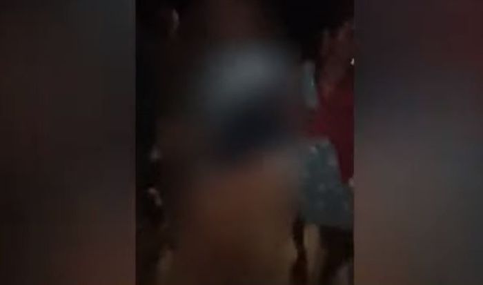 Bripka D saat diarak warga ke balai desa