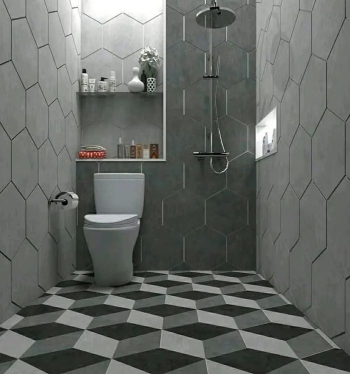 Warna abu-abu bisa menjadi pilihan untuk efek luas pada kamar mandi kecil.