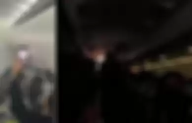 Situasi di dalam pesawat maskapai penerbangan Scott Singapura setelah sebuah powerbank meledak dan melukai dua orang penumpang. 
