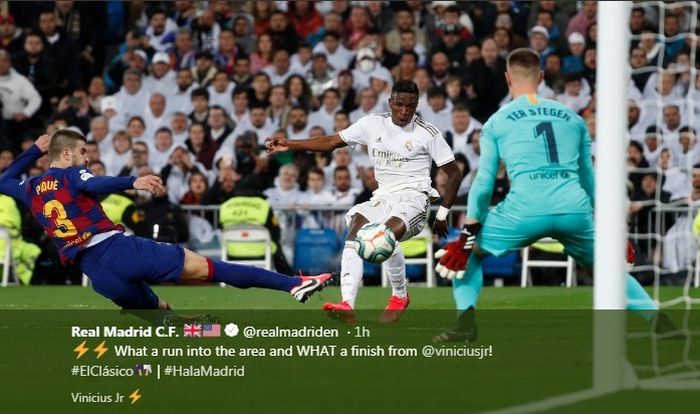 Penyerang Real Madrid, Vinicius Junior, mencetak gol ke gawang Barcelona dalam laga Liga Spanyol di Stadion Santiago Bernabeu, Minggu (1/3/2020).