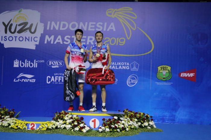 Pasangan ganda putra China, Zhang Nan/Ou Xuan Yi usai menjuarai Indonesia Masters 2019, Minggu (6/10/2019)