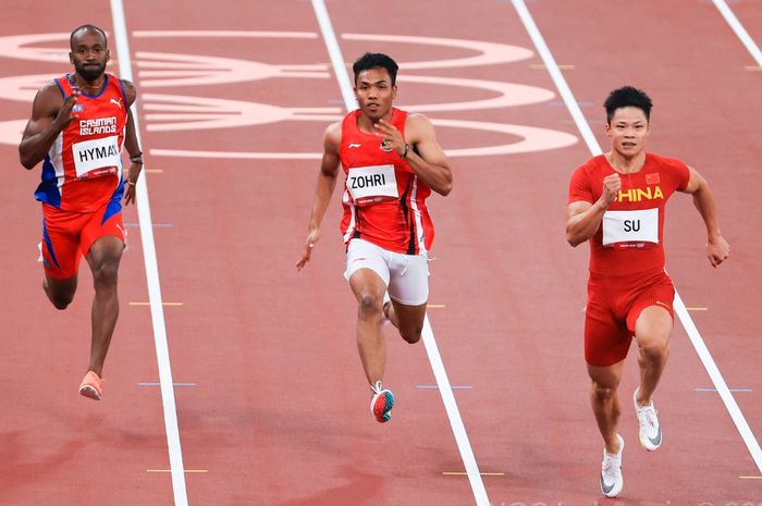 Sprinter Indonesia, Lalu Muhammad Zohri (tengah), saat tampil pada babak utama 100m putra cabang olahraga atletik, di Olympic Stadium, Tokyo, Sabtu (31/7/2021).