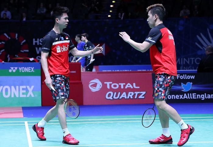 Pasangan ganda putra Indonesia, Marcus Fernaldi Gideon/Kevin Sanjaya Sukamuljo, bereaksi pada babak pertama All England Open 2019 di Arena Birmingham, Inggris, Rabu (6/3/2019).