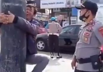 Peluk Tiang Listrik Karena Kedapatan Tidak Mengenakan Masker, Bersumpah Tidak Melanggar Lagi