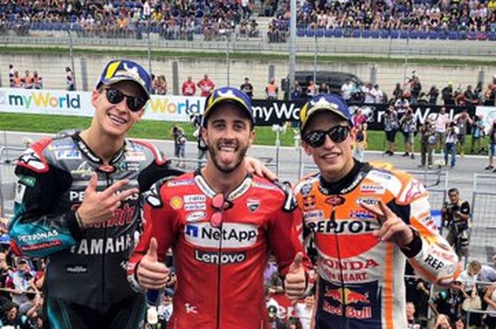Fabio Quartararo (Petronas Yamaha SRT), Andrea Dovizioso (Ducati), dan Marc Marquez (Repsol Honda) berpose di podium MotoGP Austria di Red Bull Ring, Spielberg, Minggu (11/8/2019).