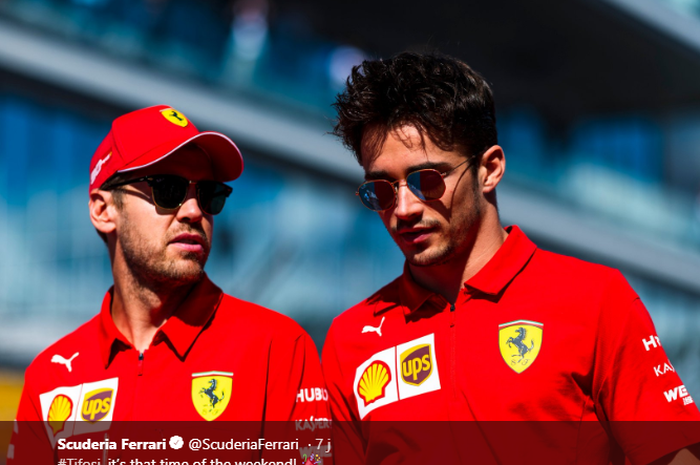 Dua pembalap Ferrari, Sebastian Vettel (kiri), berbicara kepada rekan setimnya, Charles Leclerc, jelang balapan F1 GP Rusia di Sirkuit Sochi, 29 September 2019.