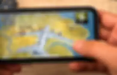 Ilustrasi bermain PUBG di iPhone